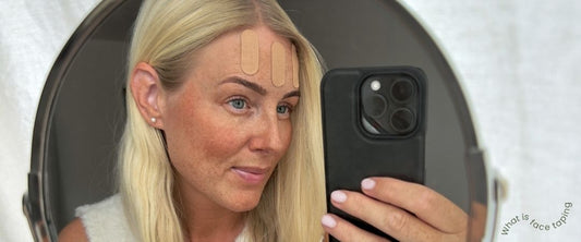 Woman wearing HOLLI pre-cut kinesiology face tape for wrinkle prevention