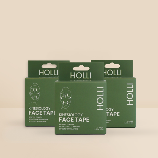 Three green boxes of HOLLI Kinesiology Face Tape Roll arranged in a fan shape on a light beige background.