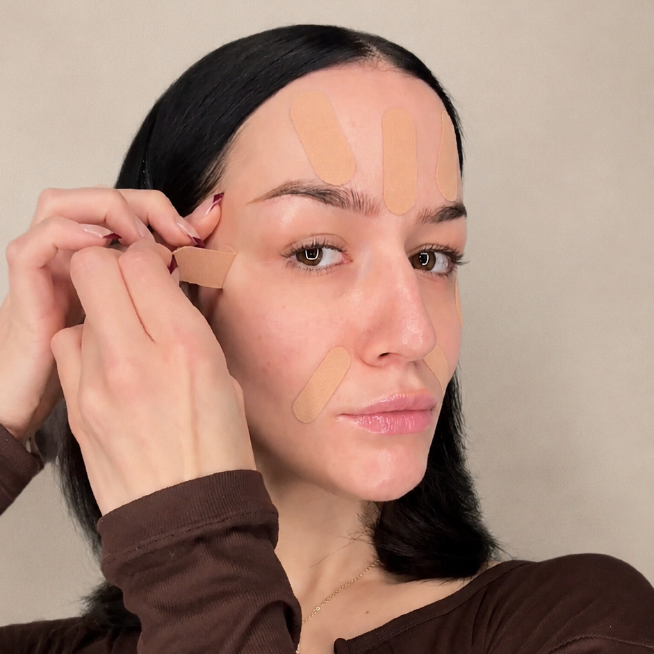 Woman removing HOLLI pre-cut face tape