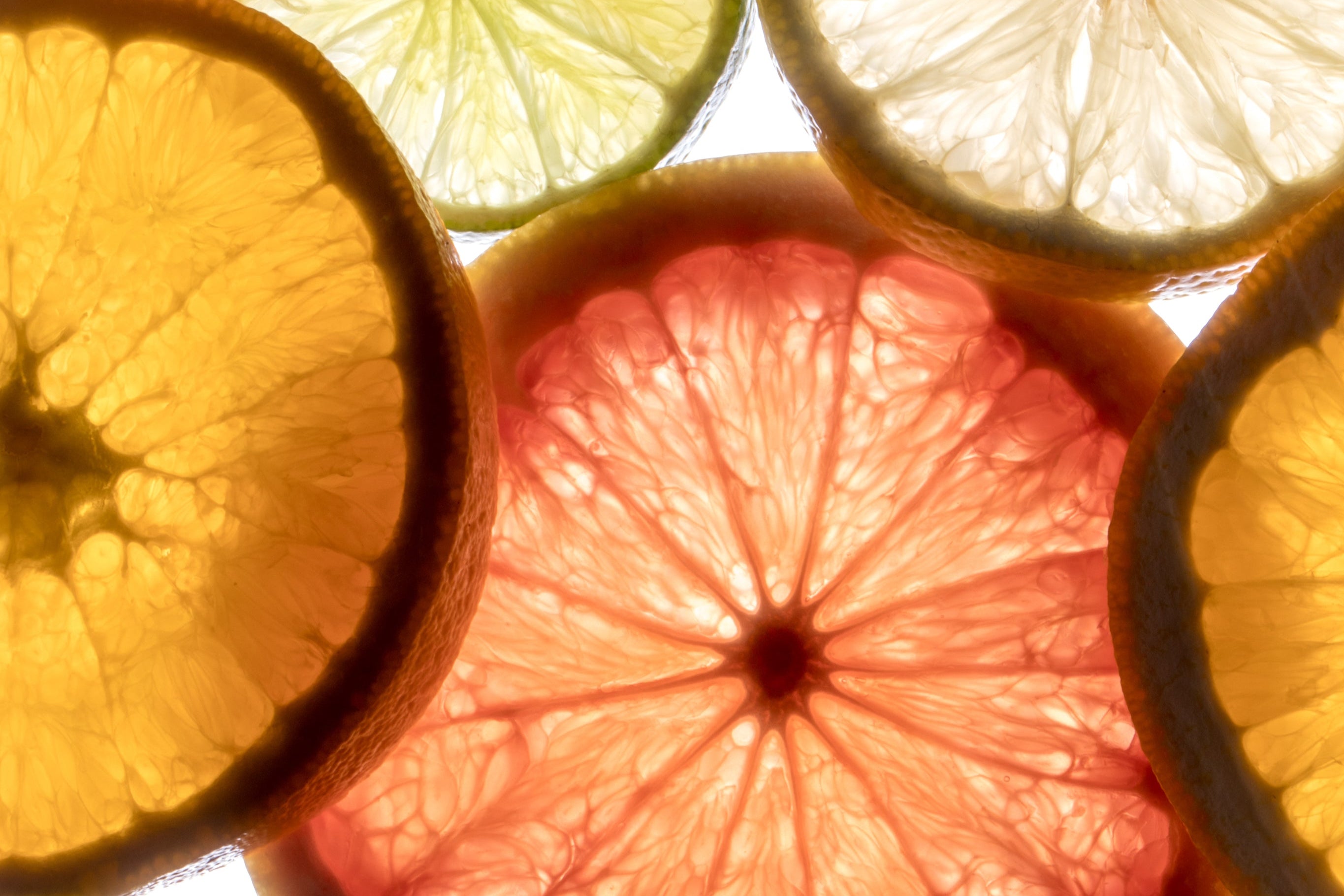 Citrus slice background representing natural wellness and holistic skin support